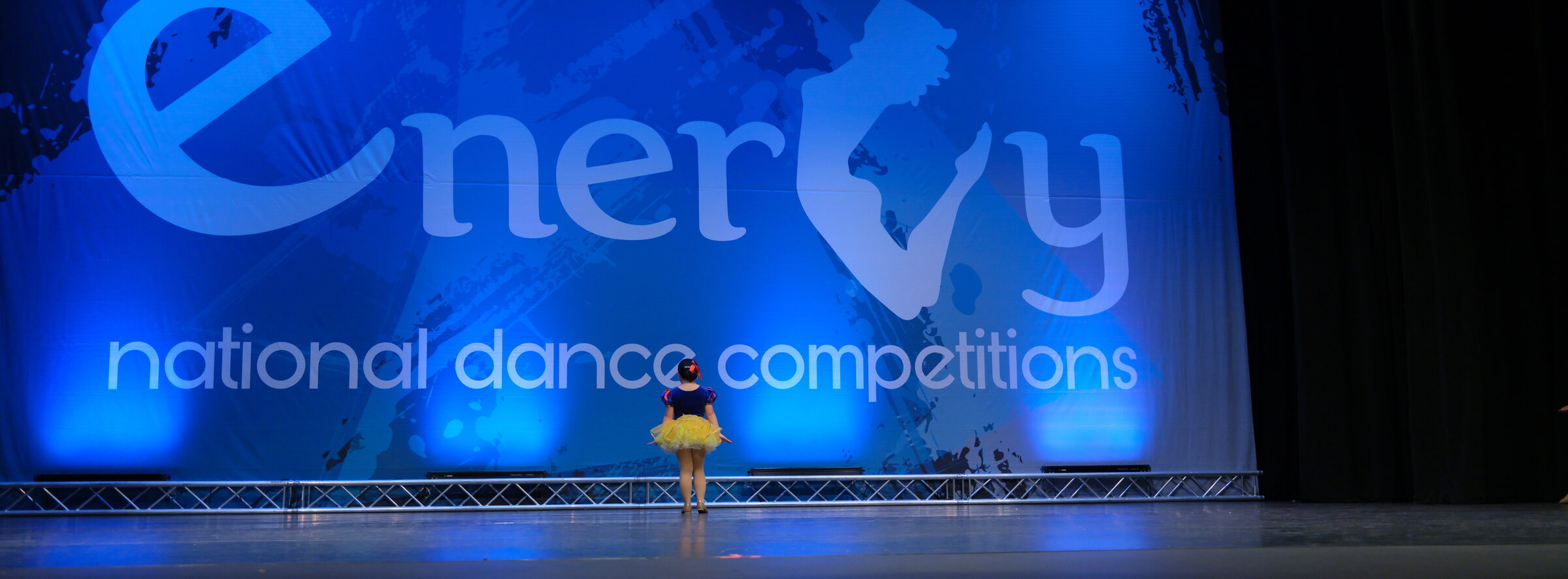 Young soloist alone on a full-size competition stage